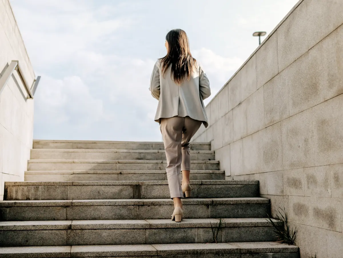 Person walking up outdoor stairs