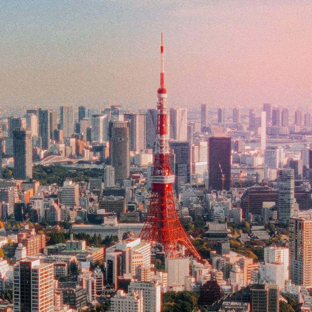 City skyline with a red and white tower
