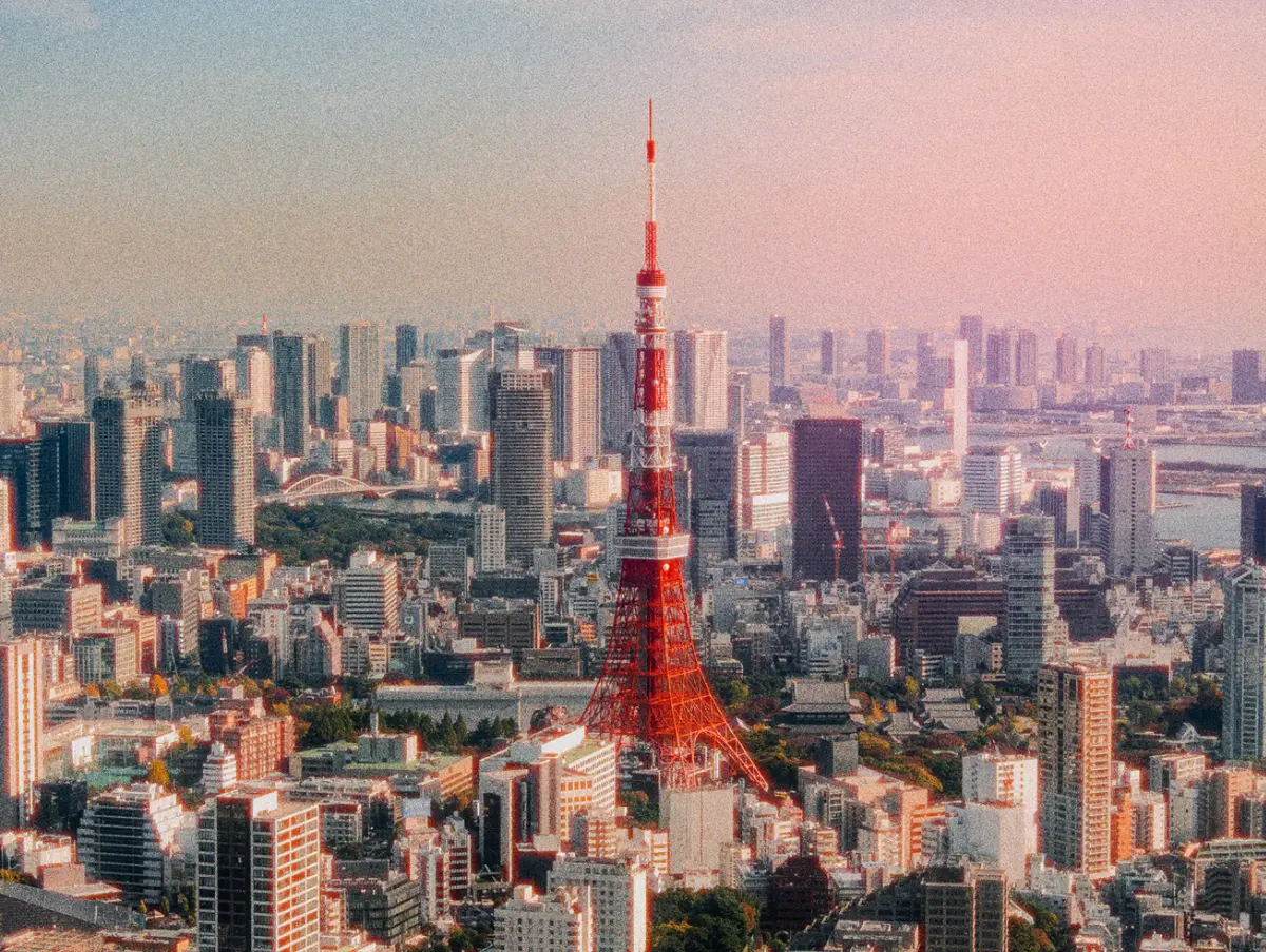 City skyline with a red and white tower