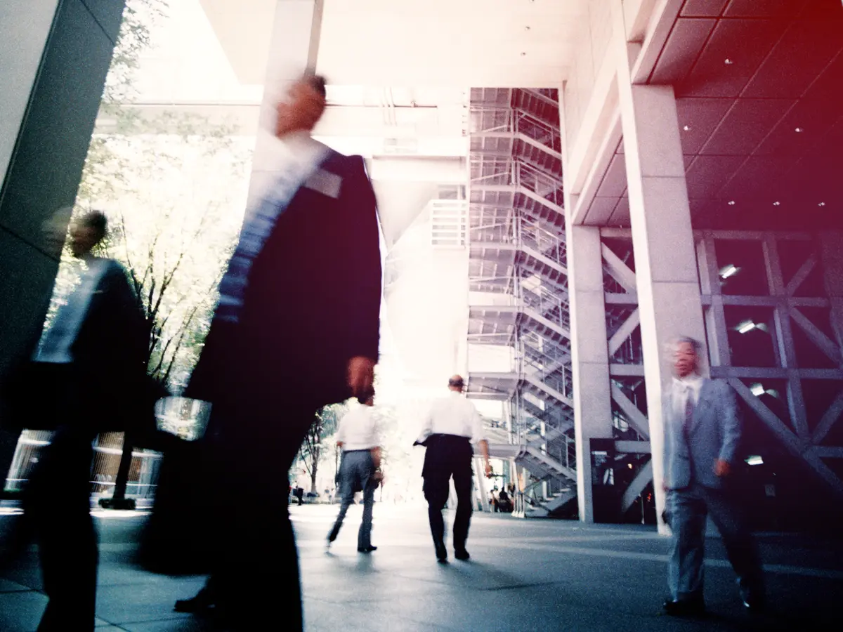Professionals walking through a modern building