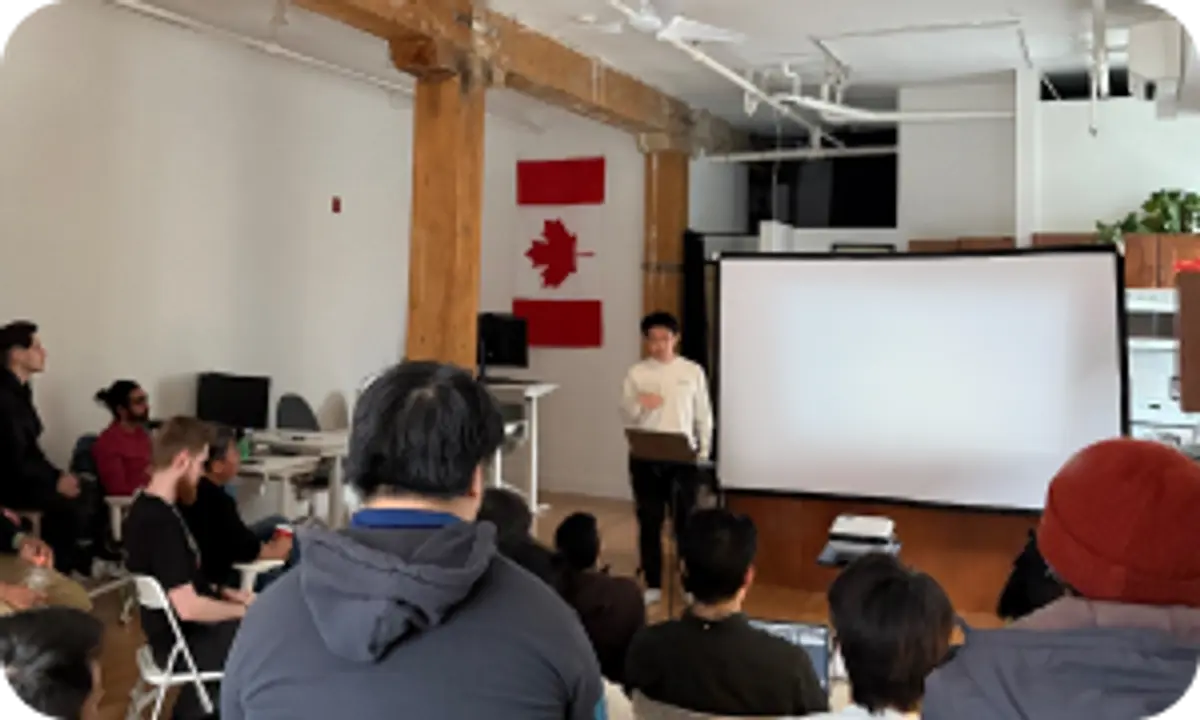 Presentation at the Barcelona office, with a speaker facing a crowd 